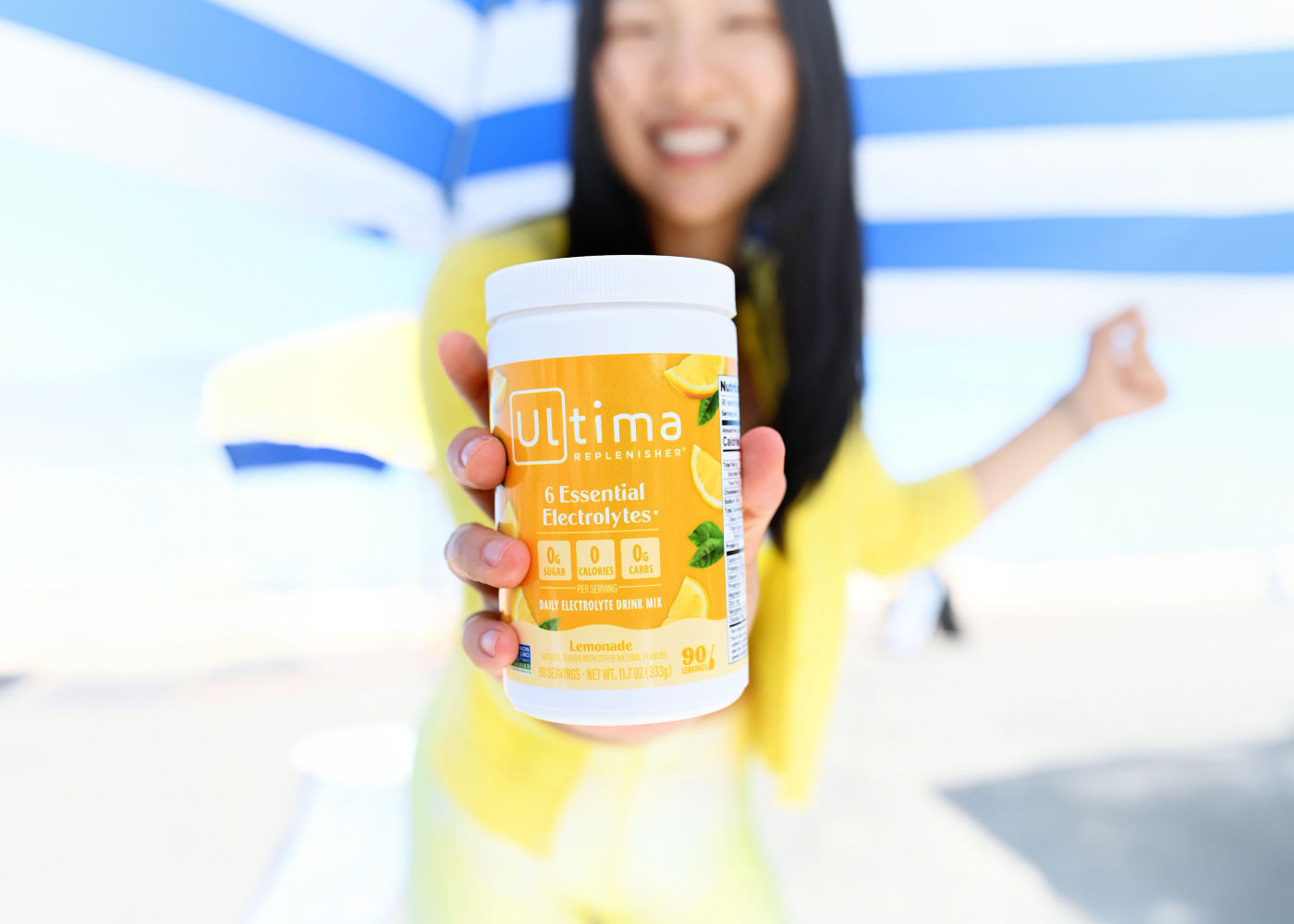 Ultima customer holding a favorite electrolyte mix